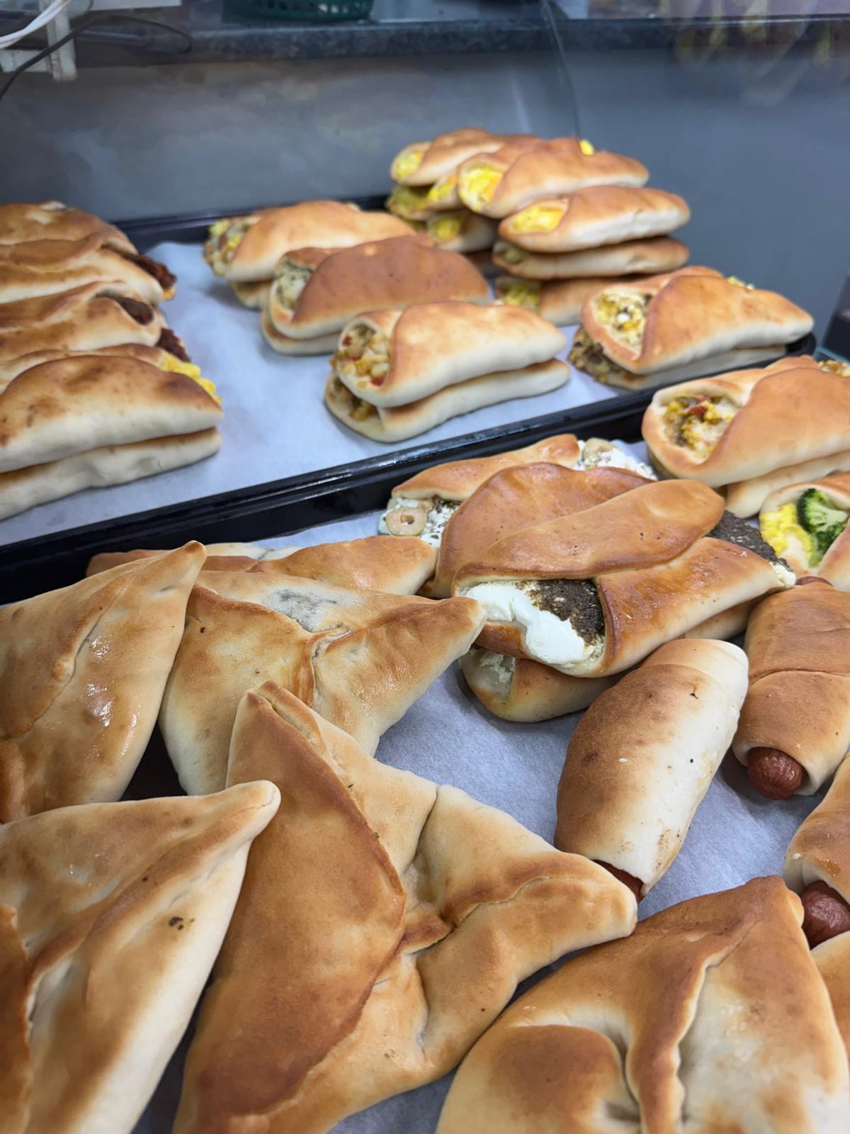 The bakery display — sambousek, pastries & more